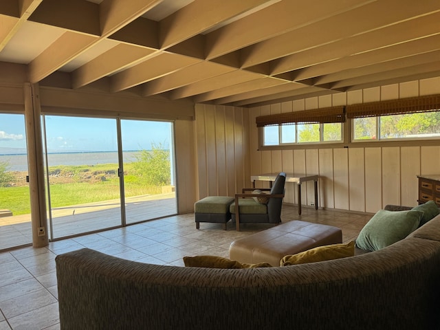 tiled living room with wooden walls and beam ceiling