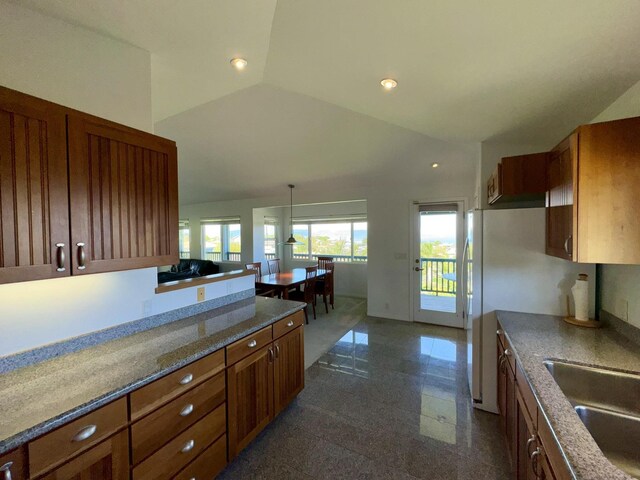 kitchen with white appliances, ceiling fan, and vaulted ceiling