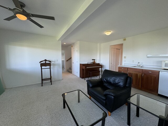 bedroom featuring light carpet, beam ceiling, and rail lighting