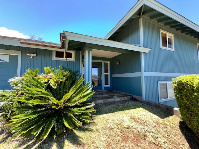 view of front of house with a garage and a porch