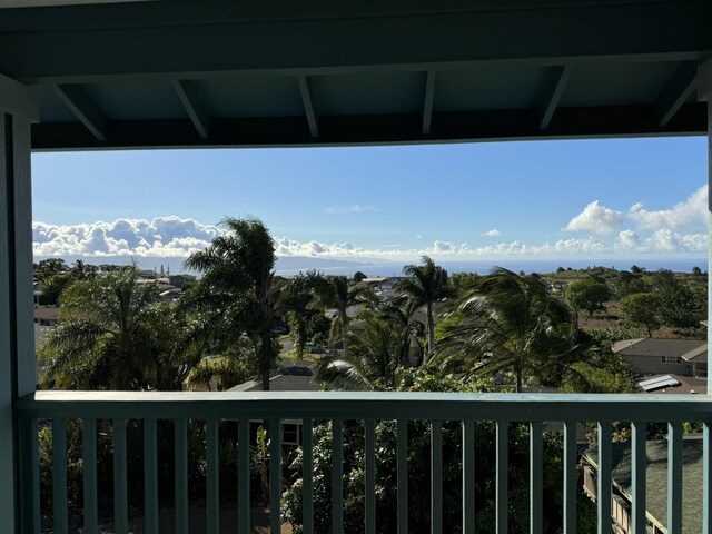 back of property featuring a balcony