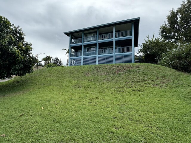 back of house with a balcony