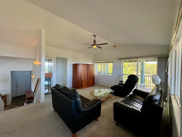 carpeted living room featuring ceiling fan and vaulted ceiling