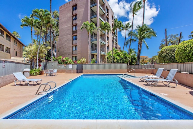 view of swimming pool featuring a patio area