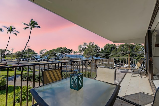 view of balcony at dusk