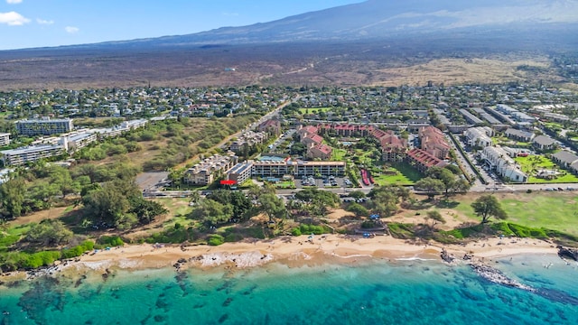 bird's eye view with a water and mountain view and a view of the beach