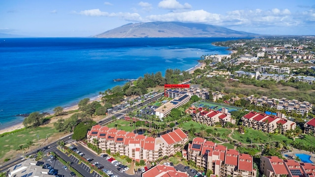 aerial view featuring a water and mountain view