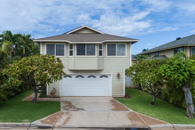 view of front facade with a front lawn and a garage