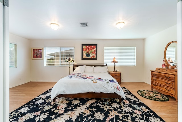 bedroom with light hardwood / wood-style floors