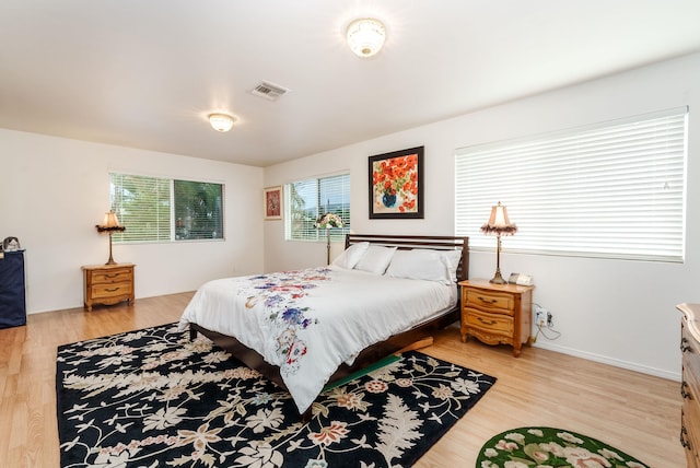 bedroom with light wood-type flooring