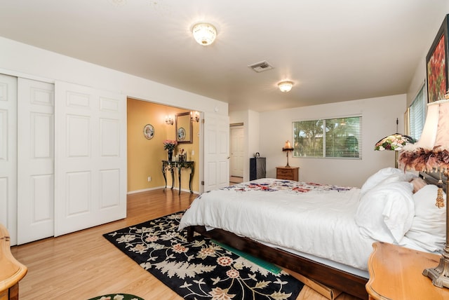 bedroom with hardwood / wood-style floors