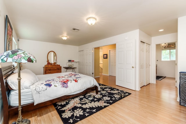 bedroom with hardwood / wood-style floors