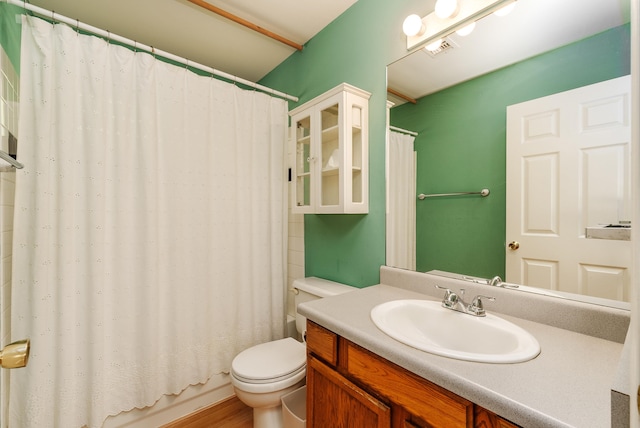 full bathroom featuring shower / bath combination with curtain, vanity, toilet, and hardwood / wood-style flooring