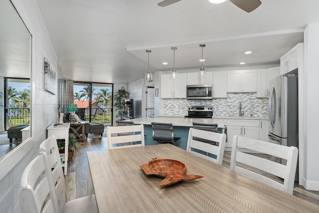 interior space featuring ceiling fan, sink, and light hardwood / wood-style floors