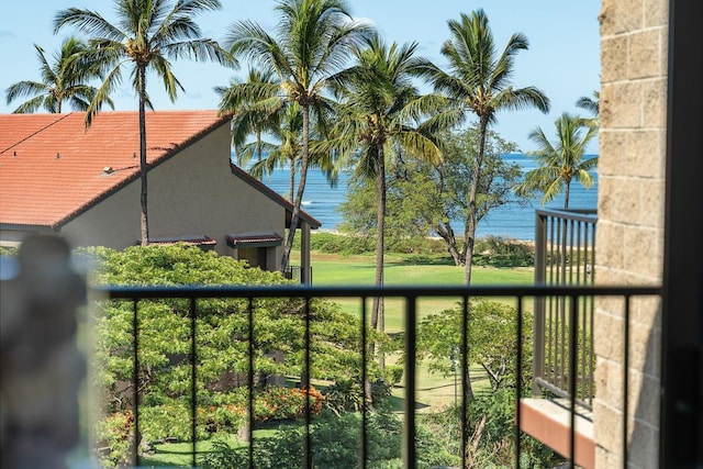 balcony featuring a water view