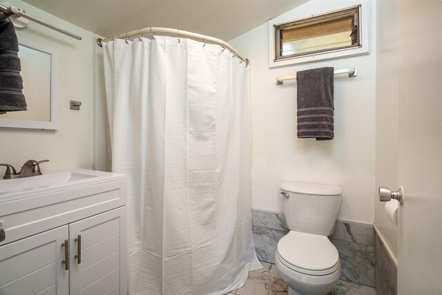 250 Kahiko St, Paia, HI 96779 - bathroom with marble finish flooring, toilet, vanity, and curtained shower