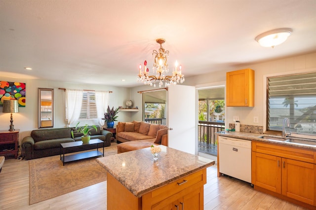 250 Kahiko St, Paia, HI 96779 - kitchen featuring white dishwasher, open floor plan, a sink, light wood-style flooring, and a chandelier