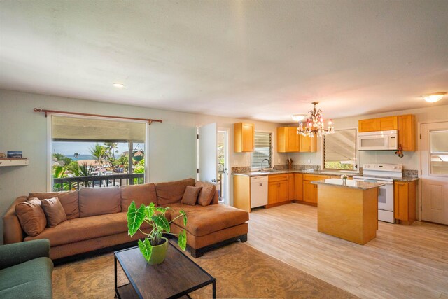 250 Kahiko St, Paia, HI 96779 - living area featuring a chandelier and light wood-style flooring
