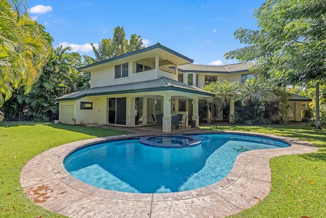 view of swimming pool featuring an in ground hot tub, a patio area, and a yard