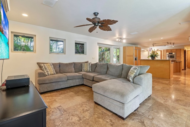 living room with ceiling fan