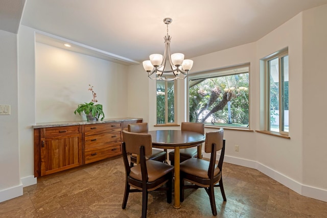 dining area featuring a chandelier