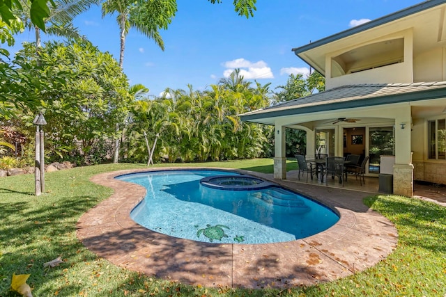 view of pool with ceiling fan, a patio, a yard, and an in ground hot tub