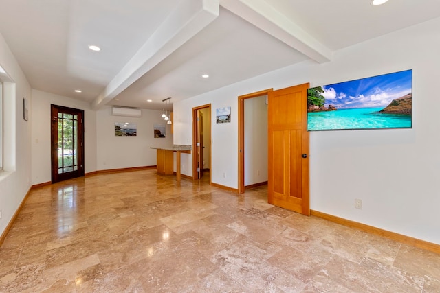 spare room with beamed ceiling and a wall mounted AC