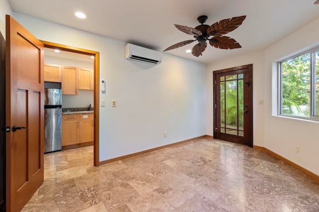 foyer featuring ceiling fan, sink, and a wall mounted air conditioner