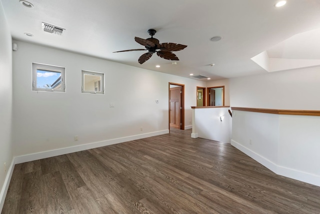 unfurnished room with ceiling fan and dark wood-type flooring