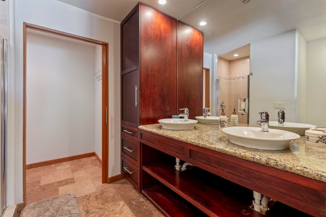 bathroom with a shower and vanity