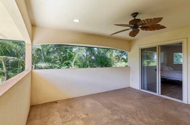 balcony with a patio and ceiling fan