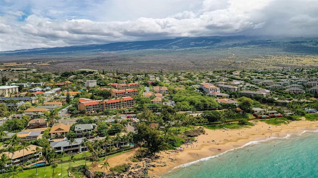 aerial view with a beach view and a water and mountain view