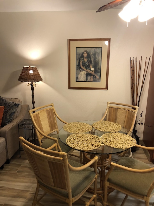 dining area with hardwood / wood-style floors