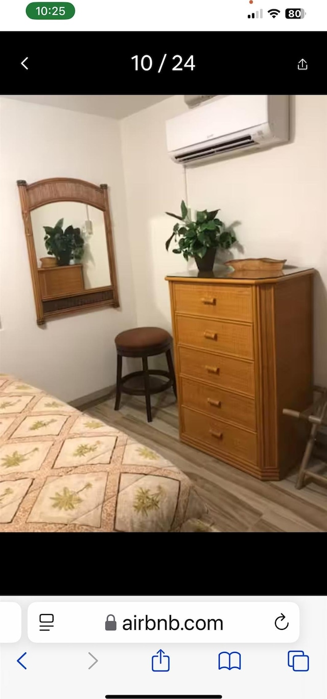 bedroom with a wall unit AC