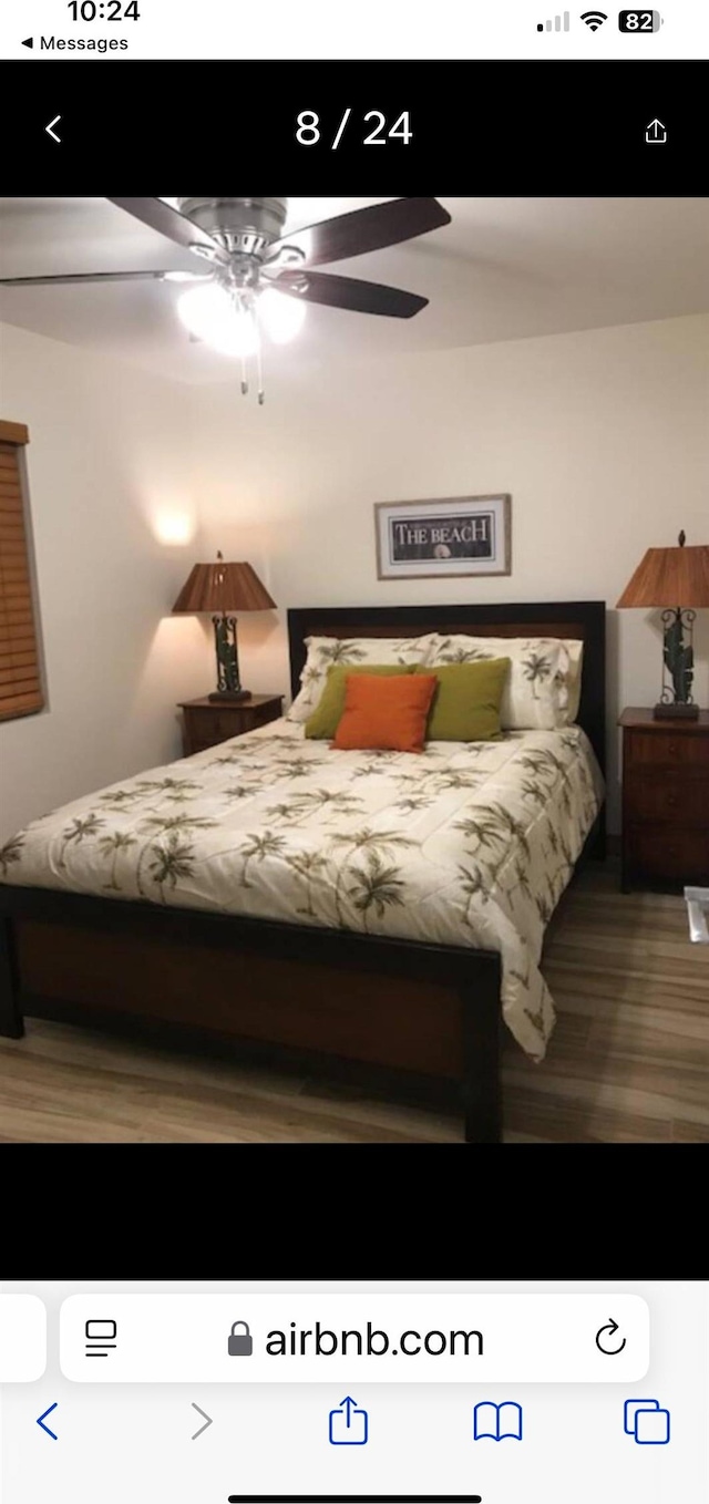 bedroom with hardwood / wood-style flooring and ceiling fan