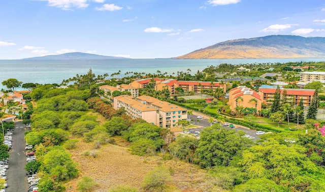 bird's eye view with a water and mountain view