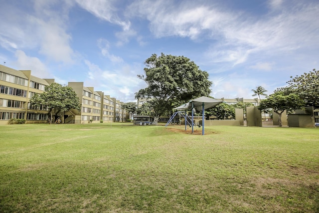 view of community with playground community and a lawn