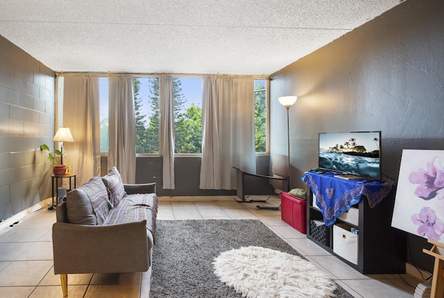 tiled living room with a textured ceiling