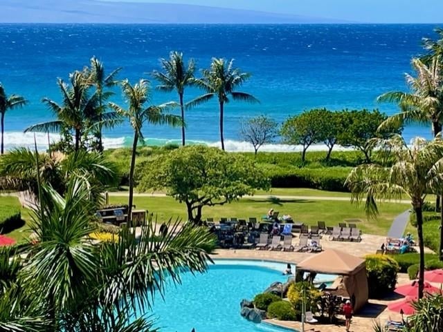 view of pool featuring a water view