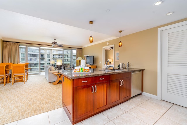 kitchen with ceiling fan, dishwasher, light tile patterned floors, and hanging light fixtures