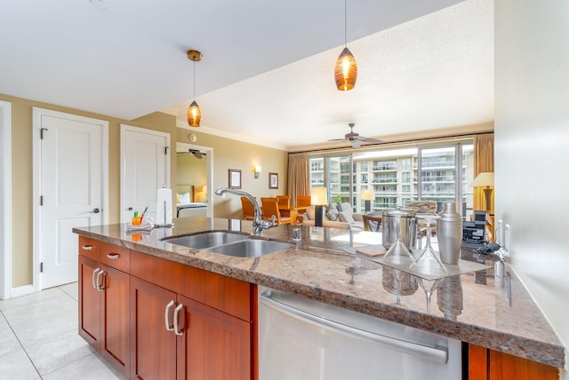 kitchen with stainless steel dishwasher, ceiling fan, pendant lighting, and sink