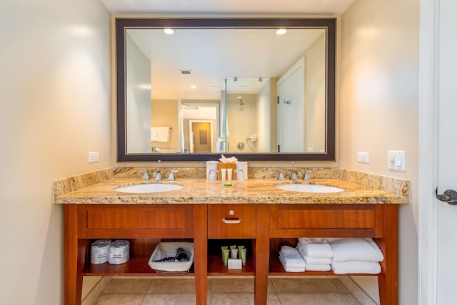 bathroom featuring tile patterned flooring and vanity