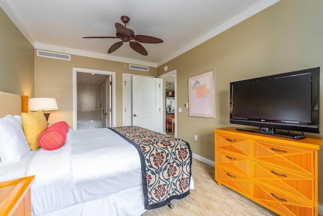 bedroom featuring ensuite bath, ceiling fan, and ornamental molding