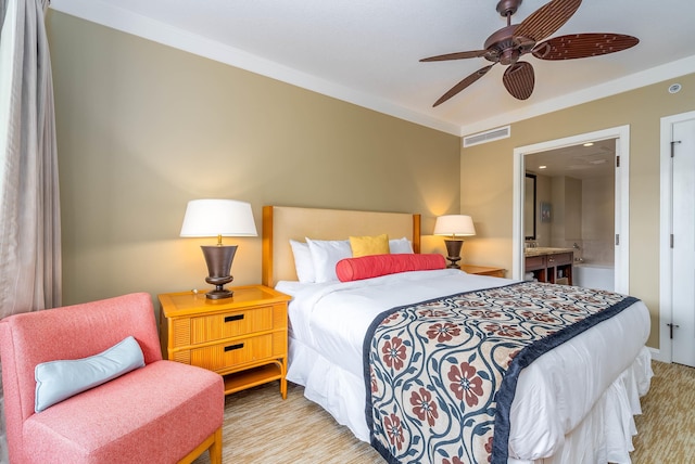 bedroom with connected bathroom, ceiling fan, and crown molding