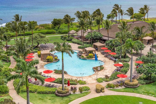 view of swimming pool featuring a water view