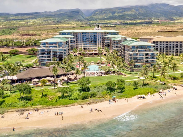 aerial view with a beach view and a water and mountain view