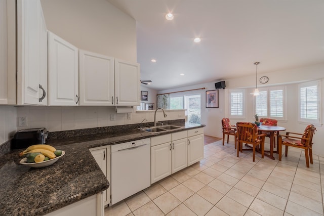 kitchen featuring sink, tasteful backsplash, hanging light fixtures, white dishwasher, and white cabinets