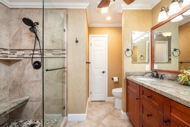 bathroom with toilet, a tile shower, vanity, ceiling fan, and crown molding