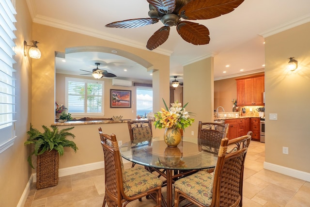 dining area featuring sink, an AC wall unit, and crown molding