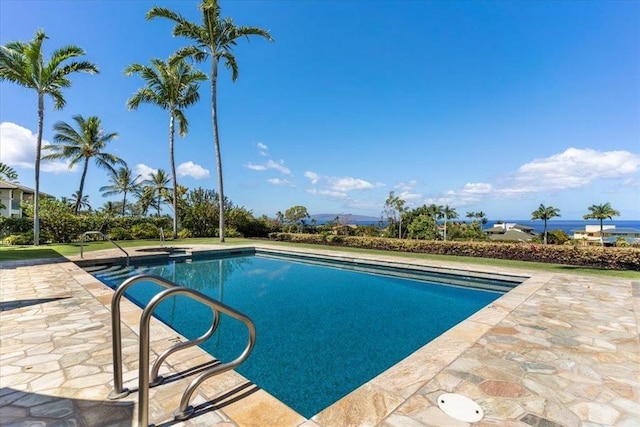 view of swimming pool with a patio area